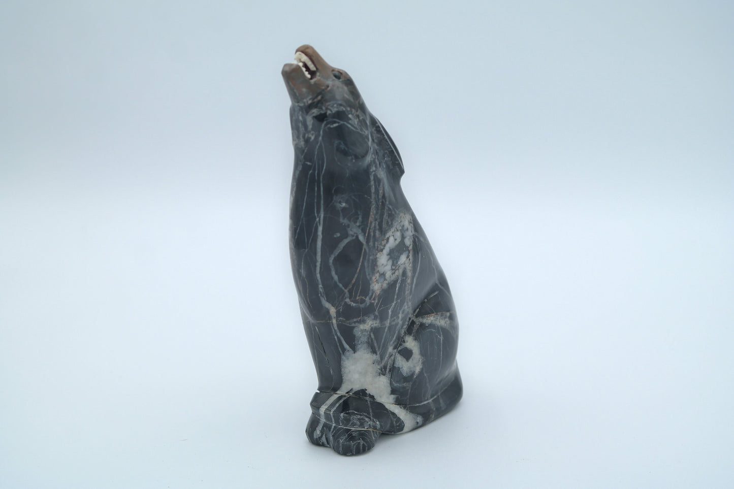 Brown and Black Jasper Wolf Carving with Sunface Inlay