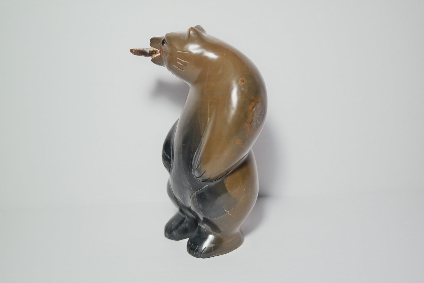 Brown and Black Jasper Bear holding a fish Carving